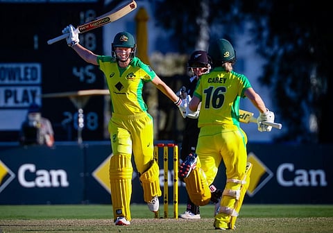 Australian captain Meg Lanning (L) raises bat to celebrate reaching her century. (Photo | AFP)
