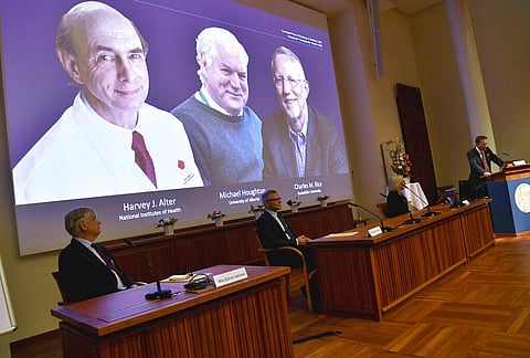 Thomas Perlmann, far right, Secretary of the Nobel Assembly announces the 2020 Nobel laureates in Physiology or Medicine during a news conference at the Karolinska Institute in Stockholm. (Photo | AP)