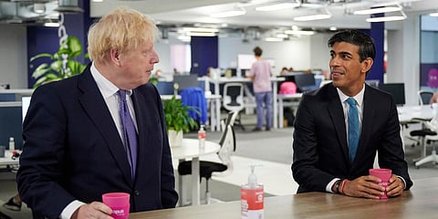 British PM Boris Johnson (L) and Chancellor of the Exchequer Rishi Sunak visit the headquarters of Octopus Energy in London. (Photo| AP)