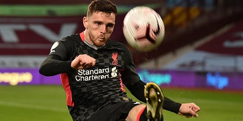 Liverpool's Andrew Robertson clears the ball during the EPL match against Aston Villa at the Villa Park stadium in Birmingham. (Photo | AP)
