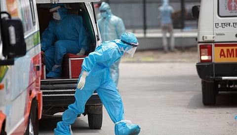 Medical workers in PPE gear outside the Covid-19 ward at Lok Nayak Jai Prakash Narayan Hospital in New Delhi. (Photo | Shekhar Yadav, EPS)