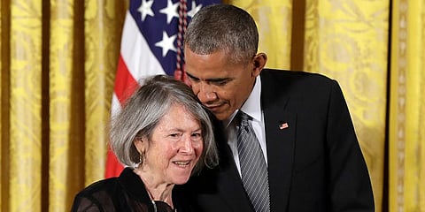 President Barack Obama embraces poet Louise Gluck before awarding her the 2015 National Humanities Medal during a ceremony in Washington. (Photo | AP)