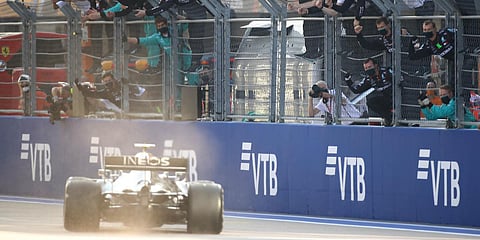 Team members cheer as Mercedes driver Valtteri Bottas of Finland steers his car to win the Russian F1 Grand Prix, at the Sochi Autodrom circuit in Russia. (Photo| AP)