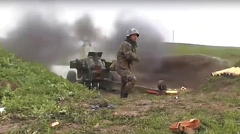 An Armenian serviceman fires a cannon towards Azerbaijan positions at the contact line of the self-proclaimed Republic of Nagorno-Karabakh, Azerbaijan. (Photo | AP)