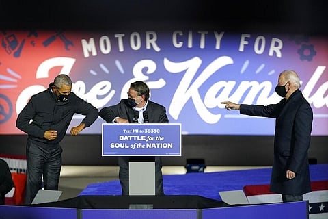 Democratic presidential candidate former Vice President Joe Biden, right, with Sen. Gary Peters, D-Mich., center and former President Barack Obama (Photo | AP)