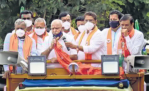 Chief Minsiter BS Yediurappa campaigns for BJP candidate from RR Nagar Muniratna, along with ministers R Ashok,  ST Somashekhar and Byrathi Basavaraj, in Bengaluru on Saturday | Express