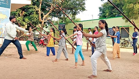 Rajasekar teaching the art of silambattam to girls | Express