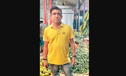 Jeffy Xavier in front of his shop