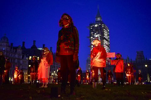 Demonstrators hold a silent vigil in Parliament Square to rise awareness on entertainment and arts world, in London. (Photo | AP)