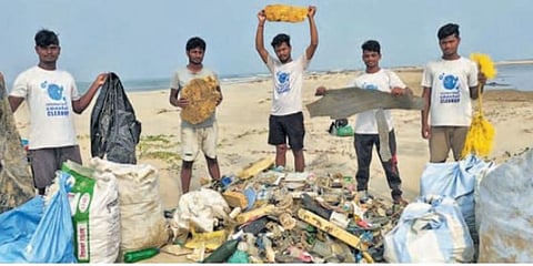 The group of youths with plastic waste and other debris collected from Devi river mouth and astaranga beach | EPS