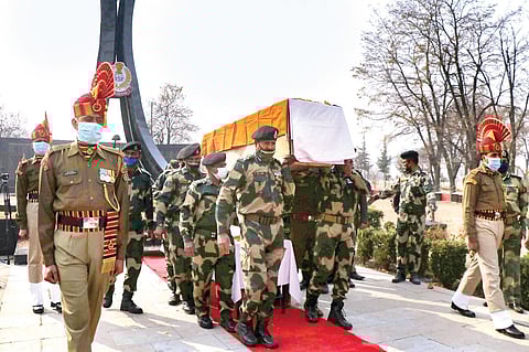 BSF personnel carry the mortal remains of their colleague Sudip Sarkar, who was killed while foiling an infiltration attempt by militants along the Line of Control in J&K’s Kupwara. (Photo | PTI)