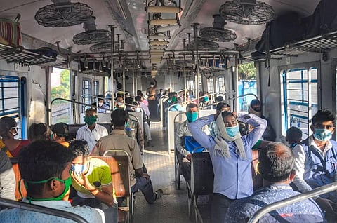 assengers board a local train at a terminal station after the authorities resumed services from today onwards amid the coronavirus pandemic in Nadia district Wednesday Nov 11 2020. (Photo | PTI)