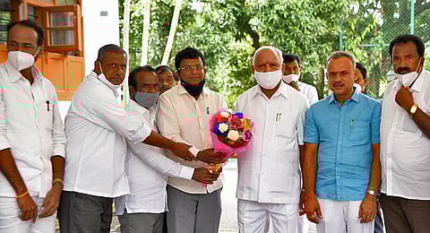 Rajesh Gowda, who won the bypoll from Sira Assembly segment recently, meets Chief Minister B S Yediyurappa in Bengaluru on Wednesday | Express