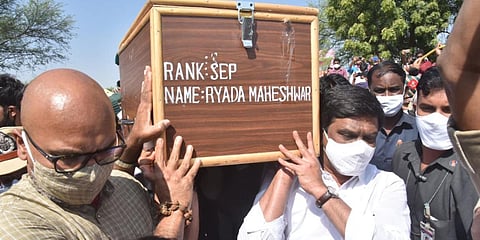 Nizamabad MP Arvind Dharmapuri and Roads & Buildings Minister Vemula Prashanth Reddy,  along with other officials, carry the mortal remains  of Army soldier Ryada Maheshwar. (Photo| EPS)