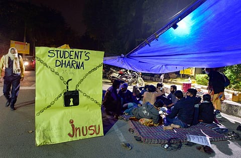 JNU students during a protest in support of their various demands, at North Gate of the campus in New Delhi. (Photo | PTI)
