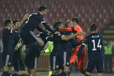 Scotland players celebrate their victory in the Euro 2020 playoff final soccer match between Serbia and Scotland, at the Rajko Mitic stadium in Belgrade, Serbia, Thursday, Nov. 12, 2020. (Photo | AP)