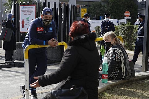 People wait outside the first aid area of the Cardarelli hospital in Naples, Italy, Friday, Nov. 13, 2020. (Photo | AP)