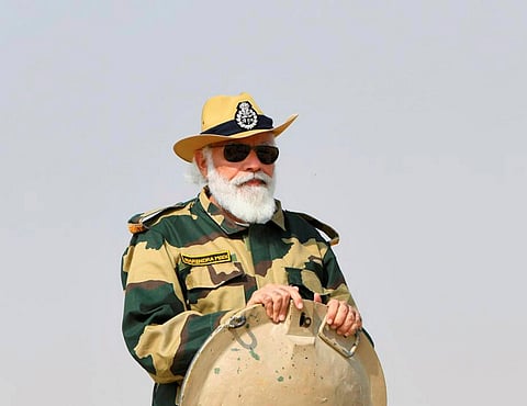 Prime Minister Narendra Modi rides a tank during his visit to strategic Longewala post in Jaisalmer. (Photo| PTI)