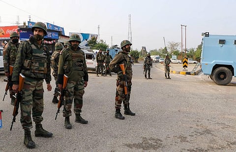 Security personnel inspect the site of encounter at Nagrota Ban toll plaza in Jammu Thursday Nov. 19 2020. (Photo | PTI)