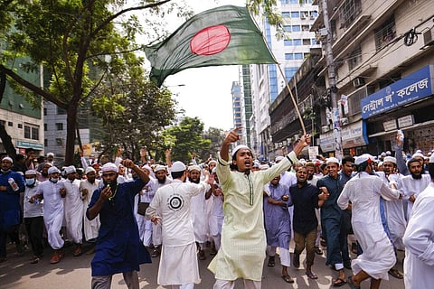 Bangladeshi Muslims protesting the French president’s support of secular laws allowing caricatures of the Prophet Muhammad march to lay siege on the French Embassy. (Photo | AP)