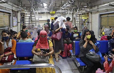 Women passengers travel on a local train in Mumbai, India. (Photo | AP)