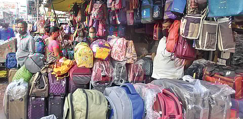 Bag sellers waiting for customers at Besant Road in Vijayawada on Sunday. (Photo I EPS/P Ravindra Babu)