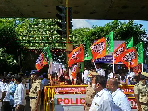 Party workers gather outside Chennai airport to welcome Union Home Minister Amit Shah (Photo | Debadatta Mallick, EPS)