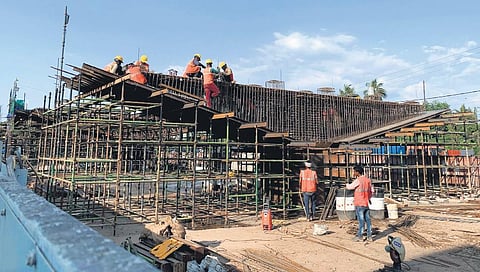 Workers engaged in reconstruction of pier caps of Palarivattom flyover. Along with Pier caps, girders and deck slabs are also being built as part of the reconstruction  | Albin Mathew