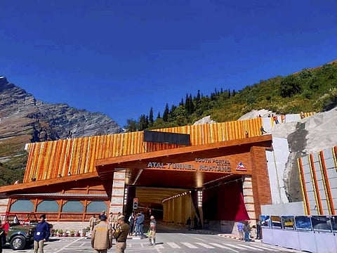 Security personnel stand guard outside the world's longest highway tunnel on Manali-Leh national highway ahead of its inauguration. (Photo | PTI)