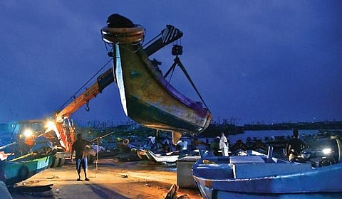 Fishermen at Kasimedu fishing harbour shifting their boats to safer places on Monday evening ahead of the expected landfall of Cyclone Nivar on Wednesday | P Jawahar