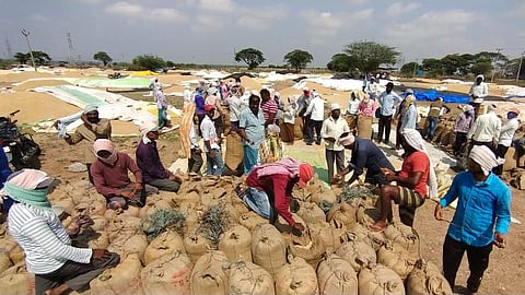 Farmers at a procurement centre in the erstwhile Warangal district.