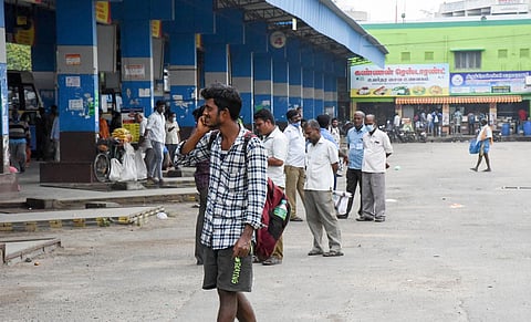 People stranded at Central bus stand in Tiruchy on Tuesday after bus services to some districts were suspended | Picture credit: MK Ashok Kumar