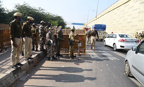 Police personnel check vehicles at Delhi UP border ahead of the scheduled farmers protest march to Delhi. (Photo | Parveen Negi, EPS)