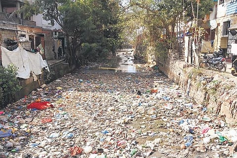A nala is choked with trash at MG Colony, Shaikpet in Hyderabad. (Photo | EPS/R V K Rao)