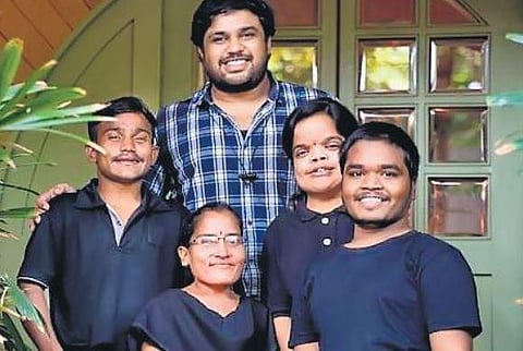 Karthik Sagiraju with the staffers of Hobbit Cafe