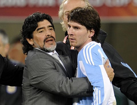 Diego Maradona hugs Argentina's striker Lionel Messi. (Photo | AFP)
