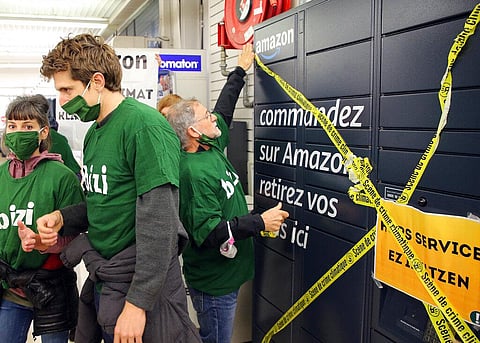 A French Basque activist from 'Bizi' ('Live' in Basque) blocks an Amazon hub in Bayonne, southwestern France, Wednesday, Nov.18, 2020. (Photo | AP)