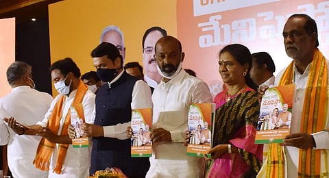 Devendra Fadnavis released BJP GHMC Manifesto for in Hyderabad on Thursday. (Photo | S Senbagapandiyan/EPS)