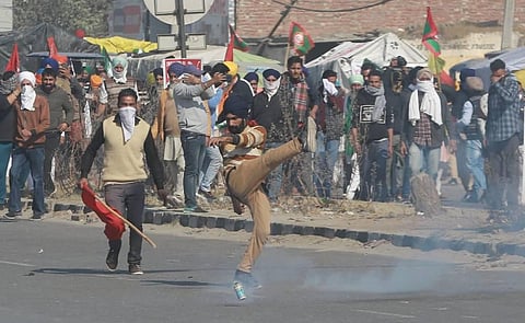 Delhi police use tear gas during the farmers protest at Singhu border in New Delhi on Friday. (Photo | Shekhar Yadav/EPS)