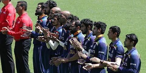 Indian players line up with match officials ahead of the first ODI cricket match against Australia at the Sydney Cricket Ground. (Photo | PTI)