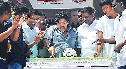 Diego Maradona cutting a cake avoiding a football -shaped part during his 52nd birthday celebrations at Jawahar Municipal Stadium in Kannur in 2012 |  A  Sanesh