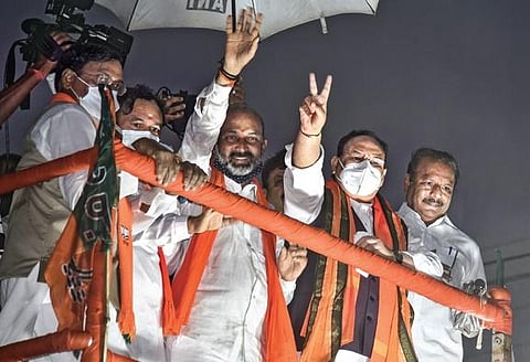 BJP national president J P Nadda, party’s State unit chief Bandi Sanjay Kumar and Union Minister of State for Home Affairs G Kishan Reddy during  a roadshow  in Hyderabad. (Photo| EPS/VINAY MADAPU)