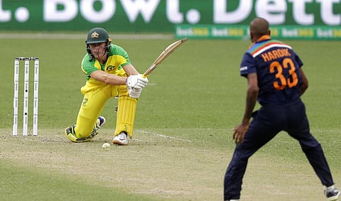 Australia's Marcus Labuschagne hits the ball back to India's Hardik Pandya. (Photo | AP)