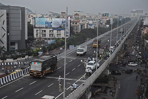 Heavy vehicles and cars ply the recently-completed Benz Circle flyover  in Vijayawada. (File Photo | Prasant Madugula, EPS)
