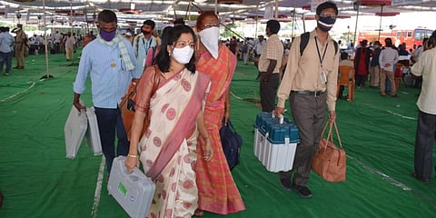 Polling officers shifting EVM machines to Dubakka ahead of byelections. (Photo| EPS)
