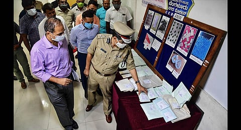 Bengaluru City Police Commissioner Kamal Pant looks at the seized contraband in the city on Monday . (Photo| Shriram BN