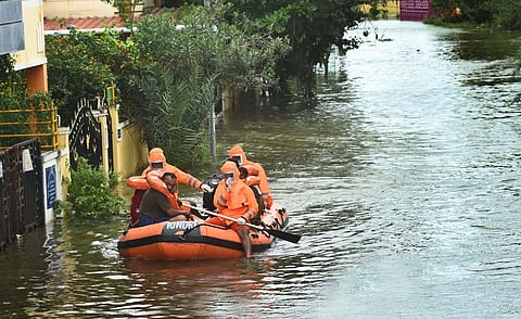 NDRF personnels rescue people at Mudichur in Chennai. (Photo | Ashwin Prasath, EPS)