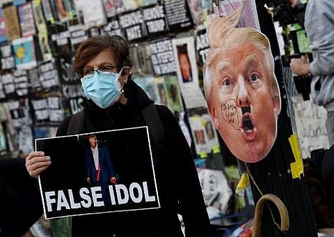 Demonstrators gather at Black Lives Matter plaza across from the White House on election day in Washington, DC on November 3, 2020. | AFP