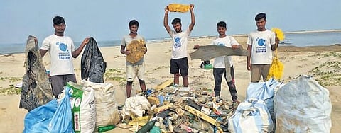 The group of youths with plastic waste and other debris collected from Devi river mouth and Astaranga beach | Express