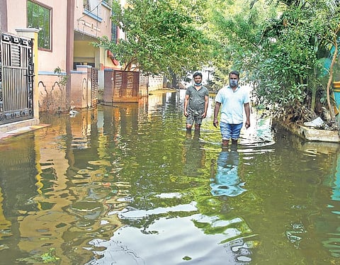 Residents wade through knee-deep water in  flood-affected MLR Colony in Meerpet on  Tuesday | RVK Rao
